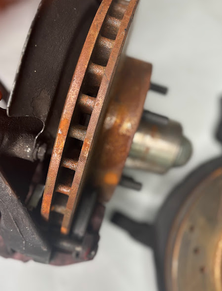Front Spindles with Brake Rotor & Caliper Set β Drilled & Slotted